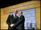 President George W. Bush is thanked by Reverend Danny Cortes after speaking at the National Hispanic Prayer Breakfast at the Andrew Mellon Auditorium in Washington, D.C., Thursday, June 16, 2005. White House photo by Eric Draper