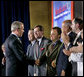 President George W. Bush greets Mark McClellan, Centers for Medicare and Medicaid Services Administrator, after speaking on Medicare at the U.S. Department of Health and Human Services Thursday, June 16, 2005. White House photo by Eric Draper