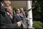 After meeting in the Oval Office, President George W. Bush shows Vietnamese Prime Minister Phan Van Khai and his delegation the Rose Garden during their visit to the White House Tuesday, June 21, 2005. It is the first visit by a Prime Minister from Vietnam in more than 30 years. White House photo by Eric Draper