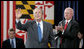 Sam Bodman, Secretary of Energy, leads the applause as President George W. Bush acknowledges the audience after speaking to 400 guests and employees at the Calvert Cliffs Nuclear Power Plant Wednesday, June 22, 2005, in Lusby, Md. White House photo by Paul Morse