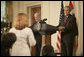 President George W. Bush and Prime Minister Ibrahim Jaafari listen to a question from the media Friday, June 24, 2005, during a press availability in the East Room of the White House. White House photo by Eric Draper