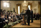 Members of the media raise their hands to President George W. Bush and Iraqi Prime Minister Ibrahim Jaafari during a media availability Friday, June 24. 2005, in the East Room of the White House. White House photo by Eric Draper