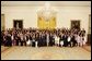 President George W. Bush and Secretary of Education Margaret Spellings stand with the 2005 Presidential Scholars in the East Room June 27, 2005. Chosen from more than 2,700 high school candidates, 141 scholars are honored for their accomplishments in academics and the arts. White House photo by Krisanne Johnson