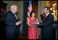 Vice President Dick Cheney swears in NASA Administrator Michael Griffin as his wife, Rebecca Griffin, holds the Bible during a ceremony in the Vice President's Ceremonial Office at the Dwight D. Eisenhower Executive Office Building Tuesday, June 28, 2005. Mr. Griffin is the 11th Administrator of the National Aeronautics and Space Administration. White House photo by David Bohrer