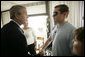 President George W. Bush shakes hands with Cpl. Matthew James after awarding the Manassas, Va., soldier with a Purple Heart during a visit Friday, July 1, 2005, to Walter Reed Army Medical Center. Cpl. James is recovering from injuries received while serving in Operation Iraqi Freedom. White House photo by Eric Draper