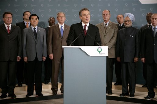 President George W. Bush and fellow G8 leaders stand behind England's Prime Minister Tony Blair Thursday, July 7, 2005, as he addressed the media at the Gleneagles Hotel in Auchterarder, Scotland, regarding the terrorist attacks that occured in London earlier in the day. White House photo by Eric Draper