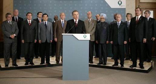 President George W. Bush stands with fellow G8 leaders as England’s Prime Minister Tony Blair issues a brief statement from Gleneagles Hotel in Auchterarder, Scotland, regarding the terrorist attacks Thursday, July 7, 2005, in London. Shortly after the statement, Prime Minister Blair departed the hotel to return to London for a security briefing. White House photo by Eric Draper