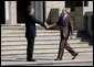 President George W. Bush is welcomed to Gleneagles Hotel in Auchterarder, Scotland, by the United Kingdom's Prime Minister Tony Blair Thursday, July 7, 2005, for the first G8 session. White House photo by Eric Draper