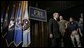 President George W. Bush walks on stage Monday, July 11, 2005, at the FBI Academy in Quantico, VA., where he spoke on the ongoing accomplishments and efforts in the war on terror. White House photo by Eric Draper