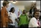 Laura Bush is greeted by a chorus of singers while visiting Mothers to Mothers-to-Be in Cape Town, South Africa, Tuesday, July 12. The program provides counseling, education and support to HIV/AIDS infected women during pregnancy. White House photo by Krisanne Johnson