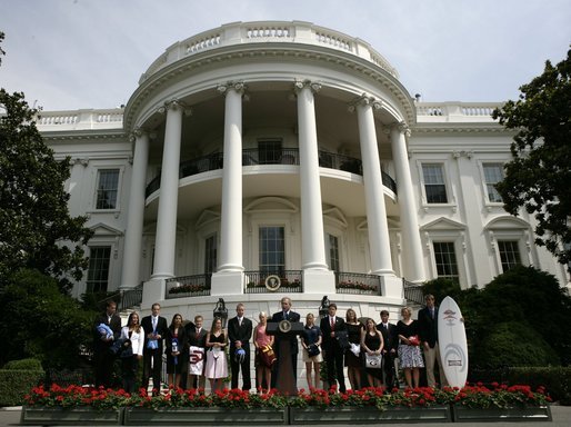 President Bush addresses an audience on the South Lawn, Tuesday, July 12, 2005, standing with the team representatives of the 2004 and 2005 NCAA Sport Championship teams being honored at the White House. White House photo by Eric Draper