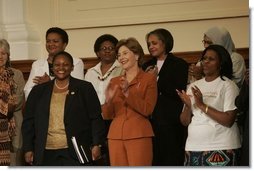 Laura Bush stands with U.S. Ambassador to South Africa Jendayi Frazer, left, during her visit to Centre for the Book, an institution established to create a culture of literacy in South Africa, Tuesday, July 12, 2005, in Cape Town.  White House photo by Krisanne Johnson