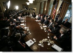 President Bush is joined by members of his cabinet as he speaks to news reporters, Wednesday, July 13, 2005, in the cabinet room at the White House.  White House photo by Eric Draper