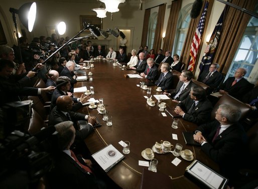 President Bush is joined by members of his cabinet as he speaks to news reporters, Wednesday, July 13, 2005, in the cabinet room at the White House. White House photo by Eric Draper