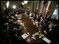 President Bush is joined by members of his cabinet as he speaks to news reporters, Wednesday, July 13, 2005, in the cabinet room at the White House. White House photo by Eric Draper