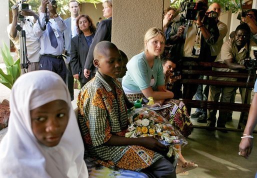 Jenna Bush listens to children with HIV/AIDS at PASADA in Dar es Salaam, Tanzania, Wednesday, July 13, 2005. “PASADA trains caregivers to provide home-based care for people living with AIDS. PASADA also provides support to orphans and other vulnerable children - boys and girls who have lost one or both of their parents to AIDS. These children need help with all the challenges that come with growing up - and with the responsibilities that an adult would usually handle,” said Mrs. Bush in her comments. White House photo by Krisanne Johnson