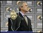 President George W. Bush stands on stage before receiving the Indiana Black Expo Lifetime Achievement Award at the Indiana Black Expo Corporate Luncheon in Indianapolis, Indiana, Thursday, July 14, 2005. White House photo by Eric Draper