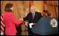 Vice President Dick Cheney congratulates Toria Nuland after her swearing-in as the Ambassador of the United States of America to the North Atlantic Treaty Organization Wednesday, July 13, 2005, at the U.S. State Department. Also pictured is Undersecretary of State Nicholas Burns. White House photo by David Bohrer