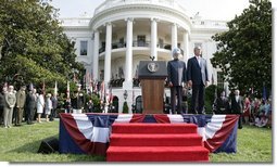 President Bush stands with India's Prime Minister Dr. Manmohan Singh, Monday, July 18, 2005 during the playing of the national anthems on the South Lawn of the White House.  White House photo by Eric Draper