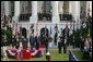 President Bush stands with India's Prime Minister Dr. Manmohan Singh in a scene of pomp and circumstance, Monday, July 18, 2005 during the playing of the national anthems on the South Lawn of the White House. White House photo by Lynden Steele