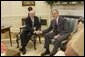 President George W. Bush shakes hands with Prime Minister John Howard of Australia, as he welcomes the Prime Minister to the Oval Office Tuesday, July 19, 2005, at the White House. White House photo by Carolyn Drake