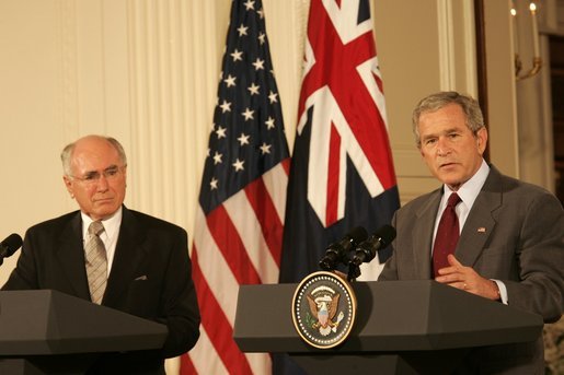 President George W. Bush gestures as he answers a reporter's question Tuesday, July 19, 2005, during a joint press availability with Australia's Prime Minister John Howard in the East Room of the White House. White House photo by Carolyn Drake