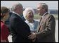 President George W. Bush and his mother Barbara Bush are greeted by Georgia Governor Sonny Perdue, upon their arrival to Atlanta, Friday, July 22, 2005, to attend events to talk about Social Security and Medicare. White House photo by Paul Morse