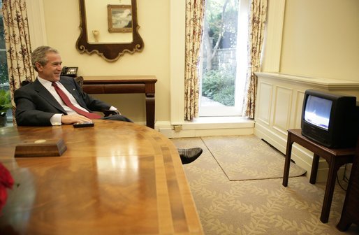 President George W. Bush watches the launch of the Space Shuttle Discovery in the Oval Office’s Private Dining Room Tuesday, July 26, 2005. White House photo by Eric Draper