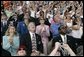 Laura Bush applauds as she folllows the launch of the Space Shuttle Discovery, Tuesday, July 26, 2005, at the Kennedy Space Center in Cape Canaveral, Florida. Mrs. Bush is joined by Florida Governor Jeb Bush, right, and NASA Astronaut Scott Altman, left. White House photo by Krisanne Johnson