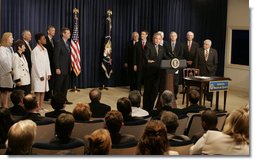 President George W. Bush, seen with members of the U.S. Senate and patient advocates, addresses an audience following his sigining of the Patient Safety and Quality Improvement Act of 2005, at a ceremony Friday, July 29, 2005 in the Eisenhower Executive Office Building in Washington, D.C. White House photo by Krisanne Johnson