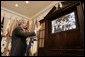  President George W. Bush smiles as he waves goodbye to the crew of the Space Shuttle Discovery Tuesday, Aug. 2, 2005, during a phone call from the Roosevelt Room of the White House. Before bidding the crew Godspeed and telling them to "get back to work," the President thanked them for being "risk-takers for the sake of exploration." White House photo by Paul Morse