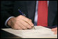 President George W. Bush signs H.R. 6, The Energy Policy Act of 2005 at Sandia National Laboratory in Albuquerque, New Mexico, Monday, Aug. 8, 2005. White House photo by Eric Draper