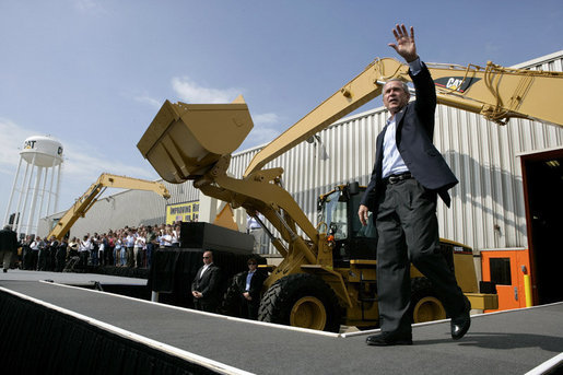 President George W. Bush acknowledges the applause of the crowd as he arrives to sign the Transportation Equity Act, at the Caterpillar facility in Montgomery, Ill., Wednesday, Aug. 10, 2005. White House photo by Eric Draper