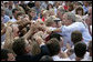 President George W. Bush greets the crowd after signing the Transportation Equity Act, at the Caterpillar facility in Montgomery, Ill., Wednesday, Aug. 10, 2005. White House photo by Eric Draper