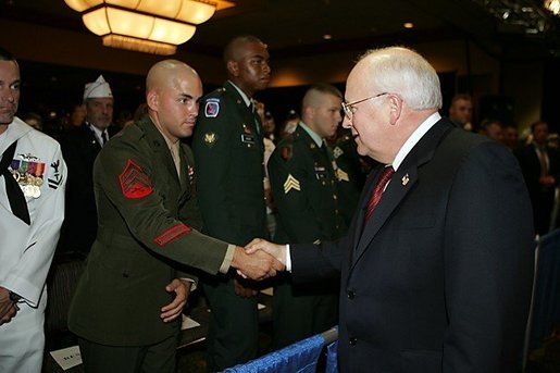 Vice President Dick Cheney shakes the hand of Sgt. Justin Genovese, US Marine Corps, who was wounded in battle in Iraq, August 4, 2004. The vice president spoke to he and other the attendees at the 73rd National Convention of the Military Order of the Purple Heart in Springfield, Missourri, Thursday, August 18, 2005. The organization was formed in 1932 for the protection and mutual interest of all who have, as a result of being wounded in combat, recieved the Purple Heart. White House photo by David Bohrer