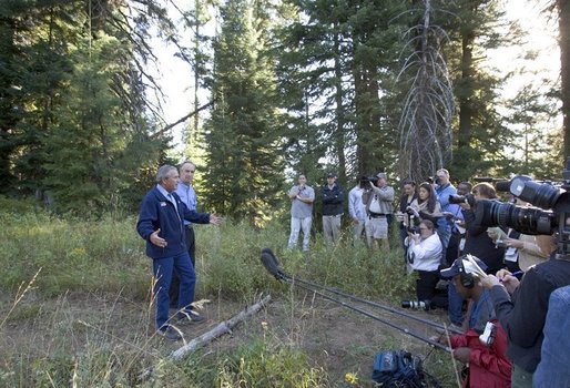 Standing with Idaho Governor Dirk Kempthorne, President George W. Bush talks with the press in Donnelly, Idaho, Tuesday, Aug. 23, 2005. White House photo by Paul Morse