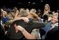 The mother of four sons currently deployed to Iraq, Tammy Pruett, is embraced by President George W. Bush following his speech at Idaho Center Arena, Wednesday, Aug. 24, 2005 in Nampa, Idaho, honoring the service of National Guard and Reserve troops serving in Afghanistan and Iraq. White House photo by Paul Morse