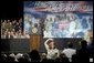 The mother of four sons currently deployed to Iraq, Tammy Pruett, acknowledges the applause of the crowd at Idaho Center Arena, Wednesday, Aug. 24, 2005 in Nampa, Idaho, after she is introduced by President George W. Bush. White House photo by Paul Morse