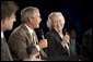 President George W. Bush shares a laugh with Myrtle Jones during a Conversation on Medicare Monday, Aug. 29, 2005, at the James L. Brulte Senior Center in Rancho Cucamonga, Calif. White House photo by Paul Morse