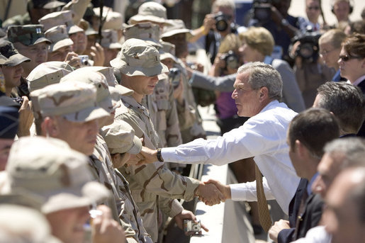 President George W. Bush shakes hands with troops at Luke Air Force Base Monday, Aug. 29, 2005, after his arrival in Arizona, where he spoke on Medicare to 400 guests at the Pueblo El Mirage RV Resort and Country Club in nearby El Mirage. White House photo by Paul Morse