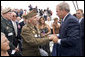 President George W. Bush greets a veteran after delivering remarks to commemorate the 60th anniversary of V-J Day at the Naval Air Station in San Diego, Calif., August 30, 2005. White House photo by Paul Morse