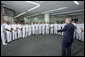 President George W. Bush talks with health care providers at the Naval Medical Center during a visit to commemorate the 60th anniversary of V-J Day at the Naval Air Station in San Diego, Calif., August 30, 2005. White House photo by Paul Morse