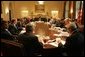 President George W. Bush speaks to members of the White House Task Force on Hurricane Katrina Recovery Wednesday, Aug. 31, 2005, shortly after returning to the White House from Crawford, Texas. The President took the opportunity aboard Air Force One to survey first-hand the devastation of the Gulf Coast. White House photo by Krisanne Johnson