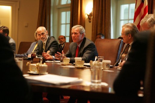 Flanked by Michael Chertoff, Secretary of Homeland Security, left, and Secretary of Defense Donald Rumsfeld, President George W. Bush meets with members of the White House Task Force on Hurricane Katrina Recovery Wednesday, Aug. 31, 2005, in the Cabinet Room of the White House. White House photo by Krisanne Johnson