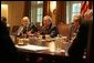 Flanked by Michael Chertoff, Secretary of Homeland Security, left, and Secretary of Defense Donald Rumsfeld, President George W. Bush meets with members of the White House Task Force on Hurricane Katrina Recovery Wednesday, Aug. 31, 2005, in the Cabinet Room of the White House. White House photo by Krisanne Johnson