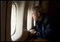 President George W. Bush looks out over the devastation in New Orleans from Hurricane Katrina as he heads back to Washington D.C. Wednesday, Aug. 31, 2005, aboard Air Force One. White House photo by Paul Morse