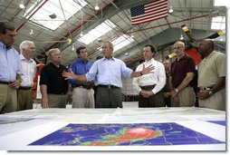 President George W. Bush talks about Hurricane Katrina disaster relief with, from left: Senator Trent Lott, R-Miss.; Senator Thad Cochran, R-Miss.; Mississippi Governor Haley Barbour; Alabama Governor Bob Riley; FEMA Director Mike Brown; Michael Chertoff, Secretary of Homeland Security, and Alphonso Jackson, Secretary of Housing and Urban Development. The President briefed the officials during his tour Friday, Sept. 2, 2005, of the Gulf Coast regions hard hit by the storm. White House photo by Eric Draper