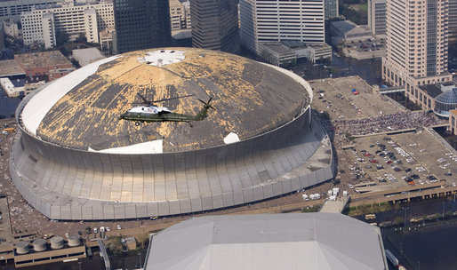 Flying aboard Marine One, President Bush surveys damage to the Superdome and the surrounding neighborhoods in New Orleans Friday, Sept. 2, 2005. White House photo by Eric Draper