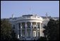 The United States flag flies at half-staff in honor of the death of Supreme Court Justice William Rehnquist, and as a mark of respect for the victims of Hurricane Katrina. White House photo by Paul Morse