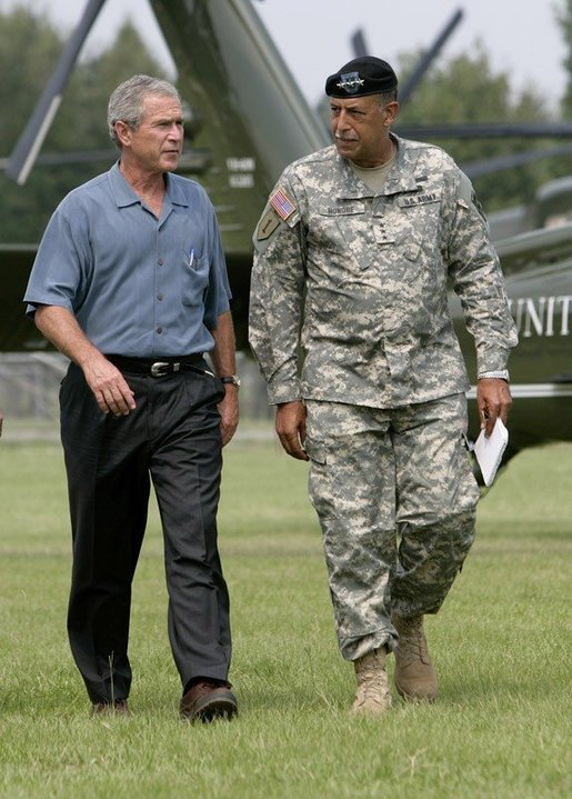 President George W. Bush and U.S. Army Lt General Russel Honore walk to the Emergency Operations Center, Monday, Sept. 5, 2005, after the President's arrival in Baton Rouge, La. White House photo by Eric Draper